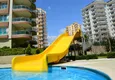 Купить Просторная трехкомнатная квартира по умеренной цене в Махмутларе 8 