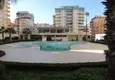 Купить Просторная трехкомнатная квартира по умеренной цене в Махмутларе 10 
