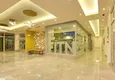 Купить Квартира с двумя спальнями в комплексе класса люкс с частным пляжем в районе Авсаллар 11 