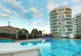Купить Квартира с двумя спальнями в комплексе класса люкс с частным пляжем в районе Авсаллар 5 