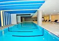 Купить Двухкомнатная квартира с видом на море в элитном комплексе района Махмутлар 12 