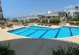 Купить Роскошная двухуровневая квартира с выходом в сад и видом на море в районе Каргыджак 19