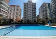 Купить Дуплекс с дизайнерским ремонтом с видом на море в молодом комплексе в Махмутларе 1 