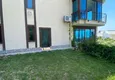 Купить Роскошная двухуровневая квартира с выходом в сад и видом на море в районе Каргыджак 20