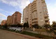 Купить Просторная трехкомнатная квартира с частичным видом на море в районе Махмутлар 3 