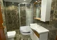 Доступная покупка Роскошная двухуровневая квартира с выходом в сад и видом на море в районе Каргыджак 9