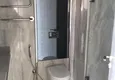 Доступная покупка Двухкомнатная квартира в районе Махмутлар с прямым видом на море 16 