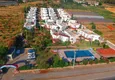 Купить Таунхаус с видом на море в районе Демирташ в жилом комплексе  3 