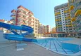 Купить Трехкомнатная квартира с видом на море в новом комплексе района Махмутлар  10 
