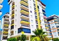 Купить Квартира в Махмутларе трехкомнатная с частичным видом на море в молодом комплексе 2 
