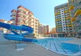 Купить Квартиры в Махмутларе с чистовой отделкой в новом комплексе на первой береговой линии 8 