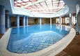 Купить Квартира в Махмутларе двухуровневая видовая с мебелью в элитном жилом комплексе отельного типа 11 