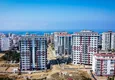 Купить Современный многоквартирный жилой комплекс в Махмутларе 11 
