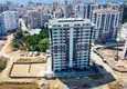 Купить Современный многоквартирный жилой комплекс в Махмутларе 3 