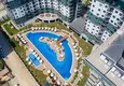 Купить Квартира в Махмутларе двухкомнатная в строящемся комплексе  3 