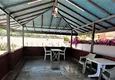 Купить Квартира в Махмутларе меблированная в жилом комплексе с видом на море и горы 10