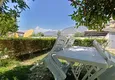 Купить Квартира в Махмутларе меблированная в жилом комплексе с видом на море и горы 12
