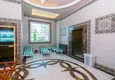 Купить Пентхаус-дуплекс расположен в 5-6 минутах ходьбы от побережья Средиземного моря на улице Ататюрка в Махмутларе с видом на море и горы 20