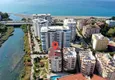Купить Квартира 2+1 с мебелью и видом на горы в комплексе на берегу горной реки, Тосмур – Алания 1