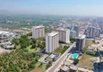 Купить Апартаменты популярной планировки 1+1 в 500 метрах от моря Мерсин, Тэдже 1 