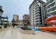 Купить Трехкомнатная квартира с мебелью в комплексе премиум-класса в Махмутларе  1 