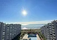 Купить Апартаменты 2+1 с прекрасным видом на море, на первой береговой линии в районе Томюк-Мерсин 1
