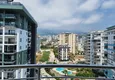 Купить дешево Пентхаус-дуплекс 4+1 меблированный с видом на море и горы, район Махмутлар – Алания 34