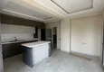 Доступная покупка Квартира 4+1 c отдельной кухней и застекленным балконом в районе Мезитли-Мерсин 15 