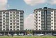 Купить Квартиры на этапе строительства в современном жилом комплексе в районе Давултепе-Мерсин 4 