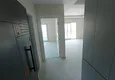 Доступная покупка Квартира 1+1 с чистовой отделкой, частично вид на море и горы в районе Томюк-Мерсин 6 