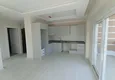 Купить Квартира 1+1 с чистовой отделкой, частично вид на море и горы в районе Томюк-Мерсин 1 