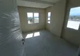 Доступная покупка Квартира 1+1 с чистовой отделкой, частично вид на море и горы в районе Томюк-Мерсин 3 