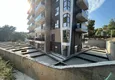 Доступная покупка Линейная четырёхкомнатная квартира с отдельной кухней в районе Оба, Алания 9 