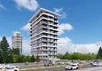 Купить Курортная недвижимость на этапе проекта – Алания, район Махмутлар, первая береговая линия 4 