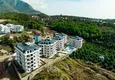 Купить Линейна квартира 3+1 под ключ с выходом в сад и видом на море - район Конаклы, Алания 9 