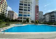 Купить Меблированные апартаменты с 2 спальнями в районе Махмутлар 4