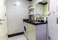 Доступная покупка Двухкомнатная квартира с застеклённым балконом в Алании, район Оба 11 