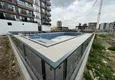 Купить Квартиры 1+1 в новом жилом комплексе в 400 метрах от моря в районе Арпачбахшиш – Мерсин 2 