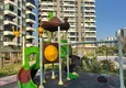 Купить Трехкомнатная квартира с видом на море и горы в современном комплексе – Мерсин, район Томюк 11