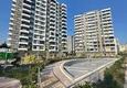 Купить Трехкомнатная квартира с видом на море и горы в современном комплексе – Мерсин, район Томюк 1