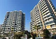 Купить Трехкомнатная квартира с видом на море и горы в современном комплексе – Мерсин, район Томюк 2