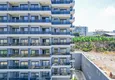Купить Двухкомнатная квартира с чистовой отделкой с видом на море и горы в Алании, район Махмутлар 4