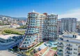 Купить Квартира 1+1 в центре Махмутлара - на 12 этаже с мебелью и видом на горы 2