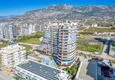 Купить Квартира 1+1 в центре Махмутлара - на 12 этаже с мебелью и видом на горы 4
