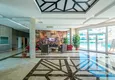 Купить Квартира 1+1 в центре Махмутлара - на 12 этаже с мебелью и видом на горы 9