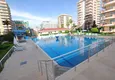 Купить Недвижимость в Алании под гражданство - квартира 2+1 с видом на море, Махмутлар, первая береговая 6