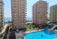 Купить Недвижимость в Алании под гражданство - квартира 2+1 с видом на море, Махмутлар, первая береговая 8