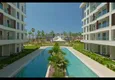 Купить Недвижимость в Алании - квартира 1+1 85 м2 с мебелью в премиальном resort-комплексе, район Тюрклер 24 