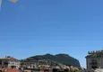 Доступная покупка Недвижимость в центре Алании - квартира 1+1 с видом на крепость и море в районе пляжа Клеопатра 15 