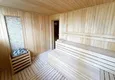 Купить Недвижимость под ВНЖ в Махмутларе - садовый дуплекс 3+1 с приватной террасой и выходом к бассейну 34 